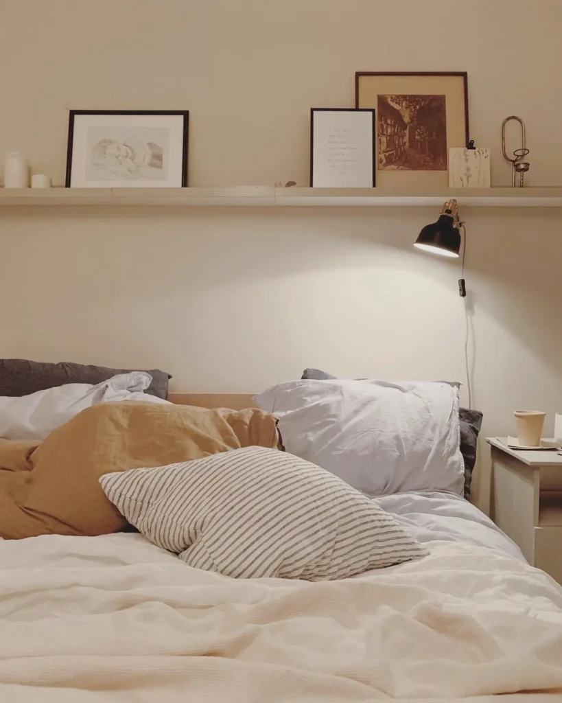 6. Use Wall Shelves Above the Bed (Safely)