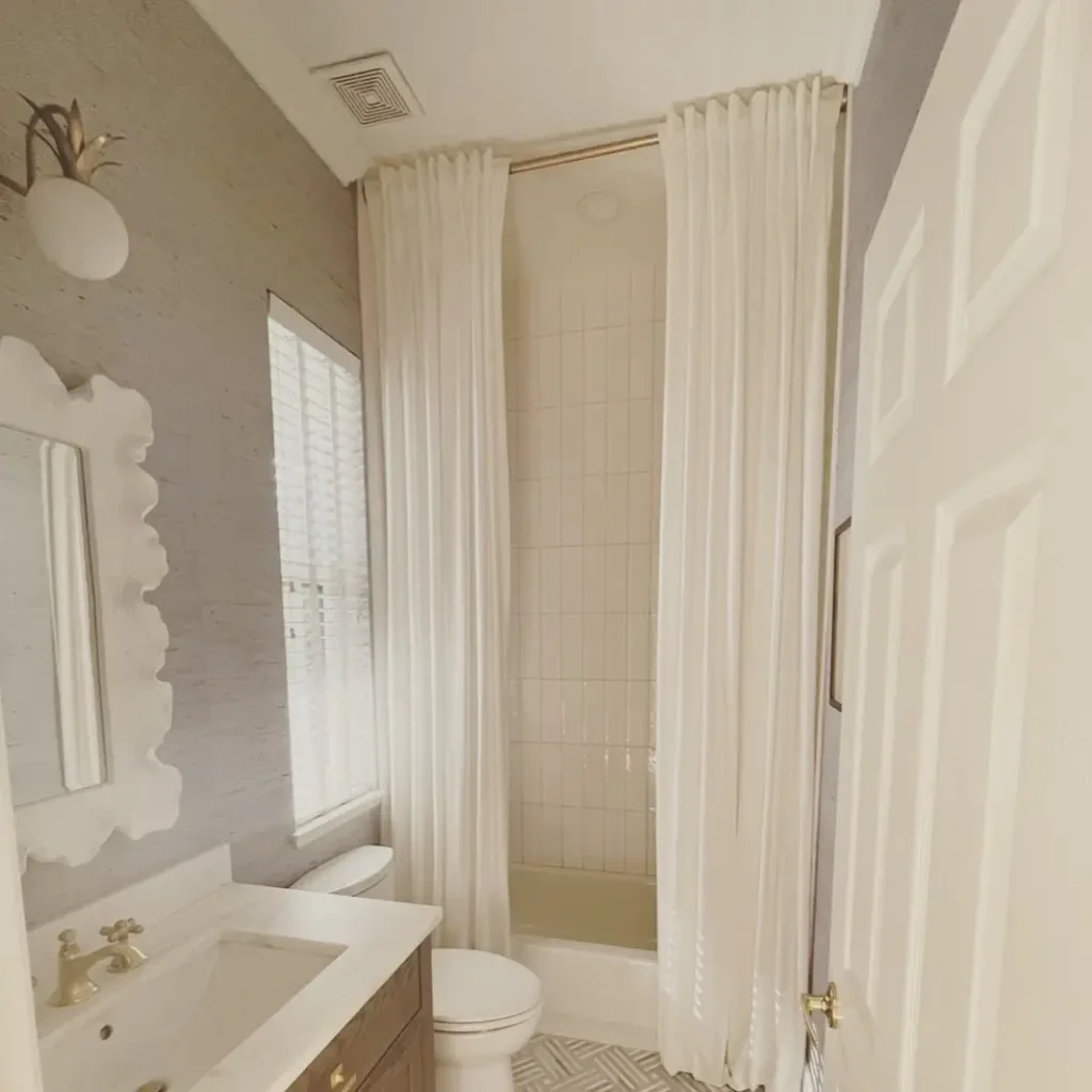 15. Add a Weighted or Linen Shower Curtain – No Plastic